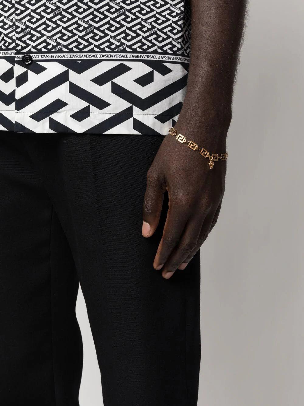 VERSACE 'greca' charm-detail bracelet Offerte